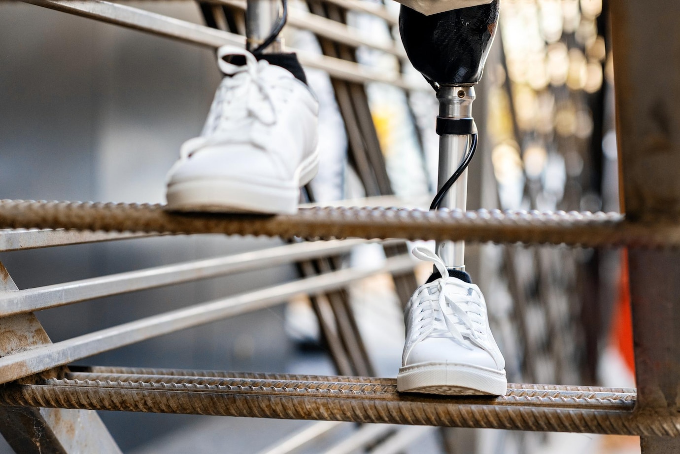 view-man-with-prosthetic-legs-white-sneakers-climbing-metal-staircase_1268-21363.jpg